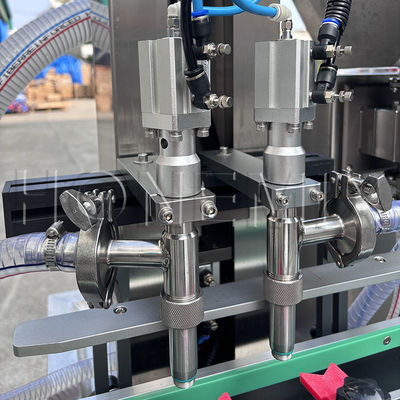 Automatica pompa di ingranaggi lozione da bagno due teste macchina di riempimento materiale di alimentazione pneumatico