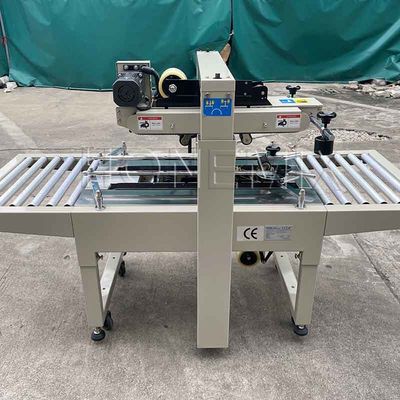 220V / 50HZ macchina di imballaggio automatico 12mm cartone scatola sigillante adesivo nastro