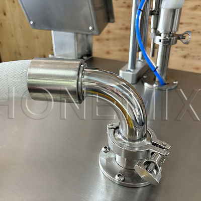 Macchina semiautomatica di riempimento di flaconi di sapone liquido e di bottiglie di profumo