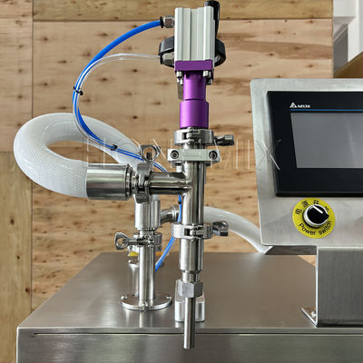 Macchina semiautomatica di riempimento di flaconi di sapone liquido e di bottiglie di profumo